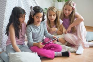 Girls Reading on a Tablet
