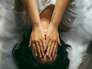 Woman Covering Her Eyes