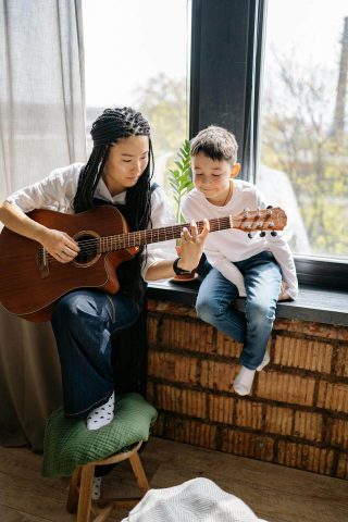 Woman Teaching Guitar