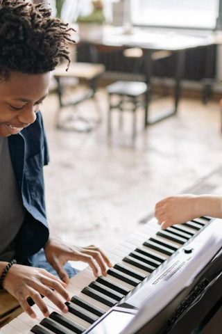 Young Man Playing the Piano Young Man Playing the Piano