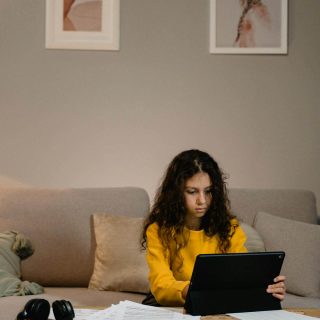 Young Person Using a Laptop at Home Young Person Using a Laptop at Home